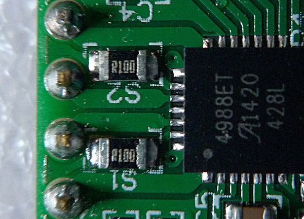 An inexpensive "Made in China" Pololu-style A4988 stepper driver board using 0.1 Ohm current sense resistors, detail.