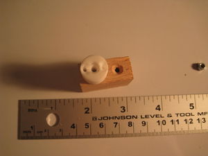 Cylindrical piece relative to oak block?