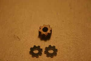 Damaged gear and replacement gear slices.JPG